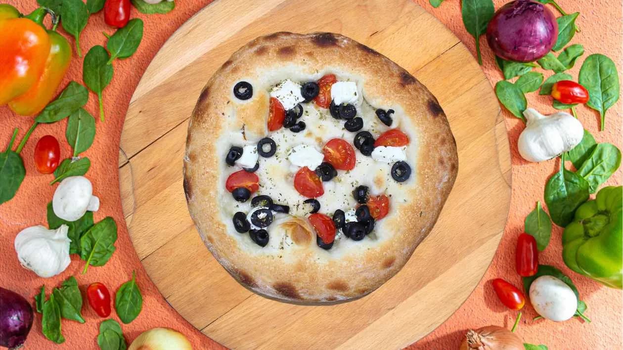 Focaccia with cherry tomatoes, feta and olives