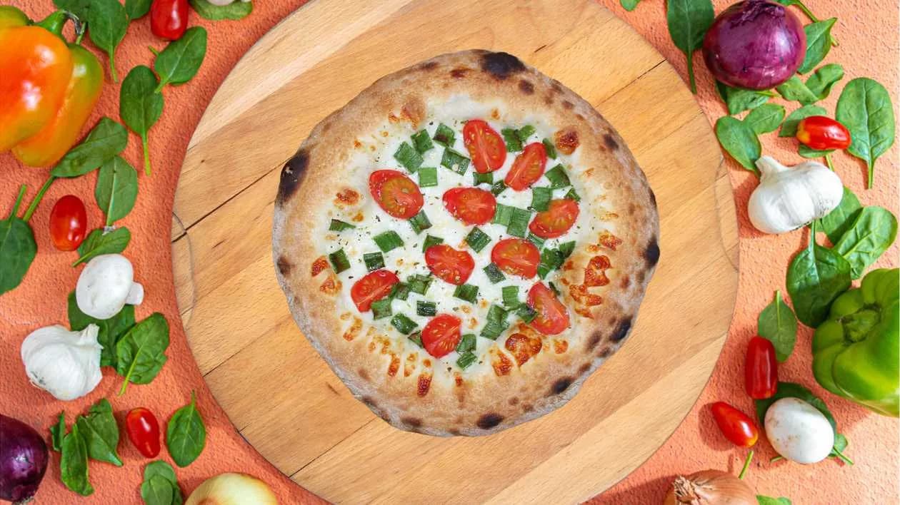 Focaccia with cheese, cherry tomatoes and green onions