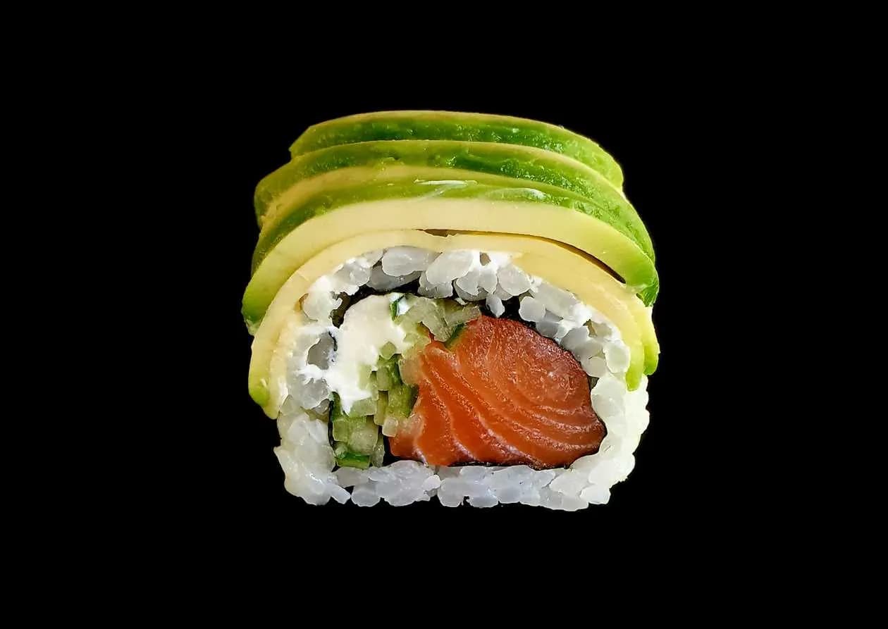 Uramaki gold salmon wrapped in avocado