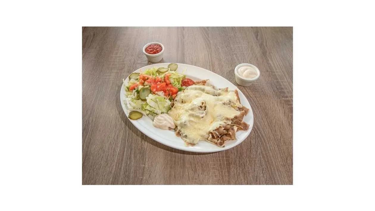 Kebab on a Plate with Yellow Cheese