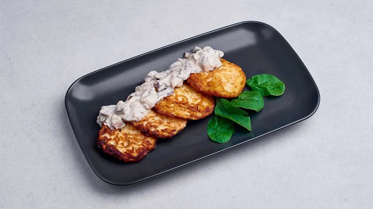 Potato Pancakes in Creamy Sauce with Champignons