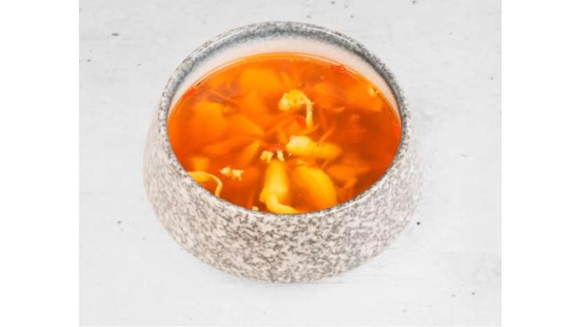 Herbal soup with chicken pieces and cordyceps