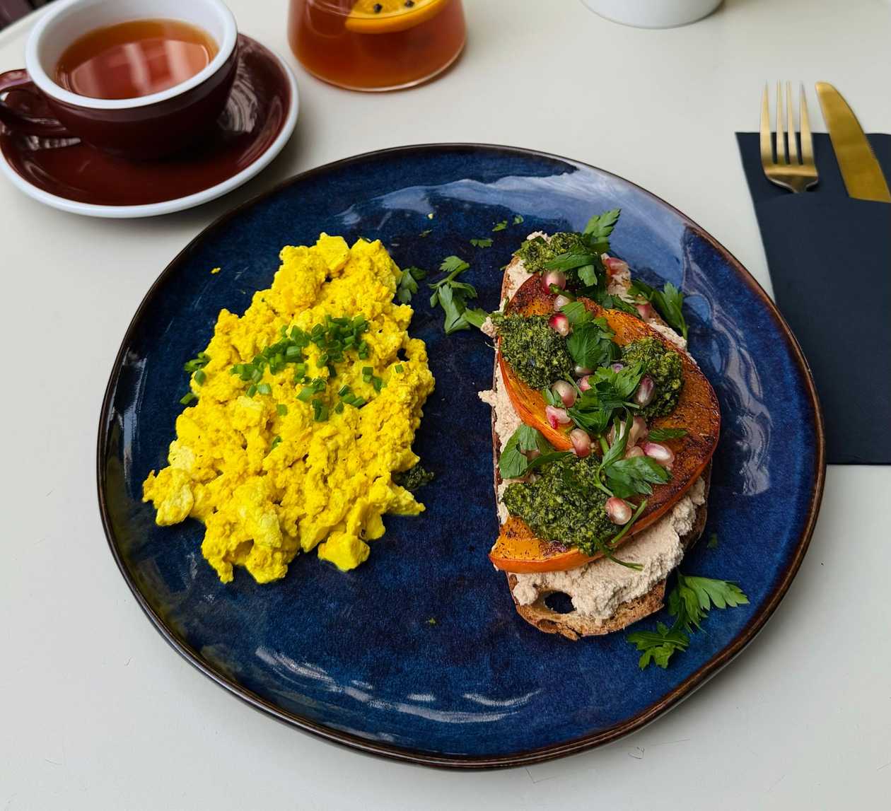 GREEN PESTO TOAST WITH WHIPPED BRYNZA, SPICY PUMPKIN & SCRAMBLED EGGS