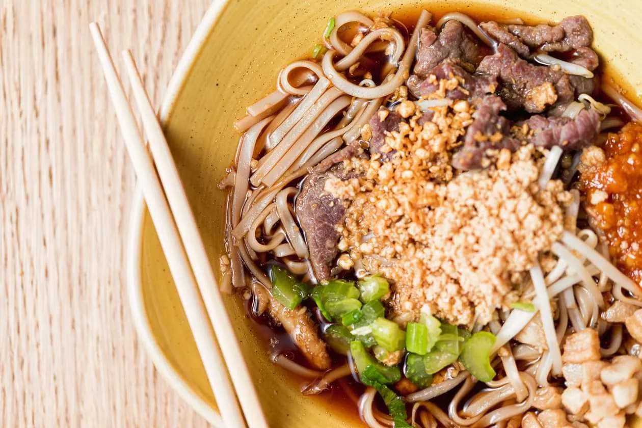 Beef Broth with Cinnamon, Beef, Pork Scratchings, Tripe, Celery and Rice Noodles, Served with Fried Garlic, Peanuts, Green Onions, Sprouts and Coriander