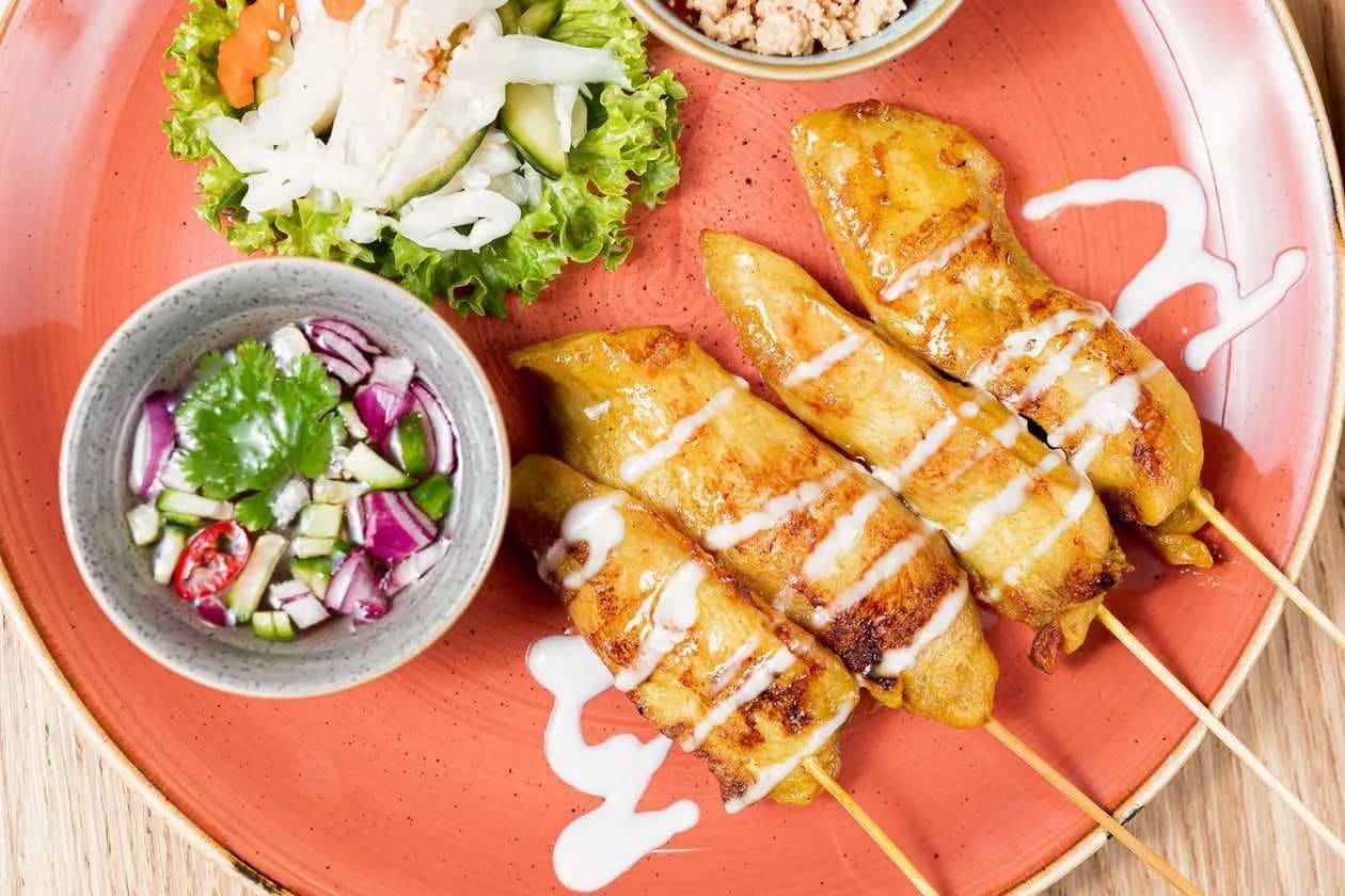 Chicken Satay Served with Spicy Peanut Sauce and Spicy Vinegar Based Dip