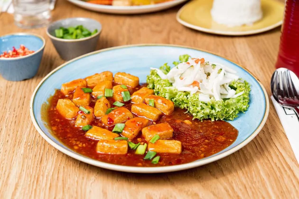 Stir Fried Tofu in Red Wine Sauce with Chili, Garlic and Ginger Served with Thai Side Salad