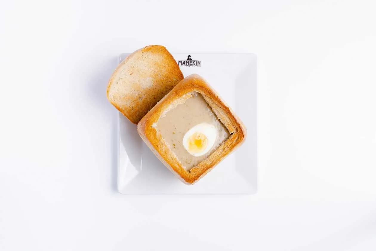 Sour Soup with Egg and Sausage Served with Bread