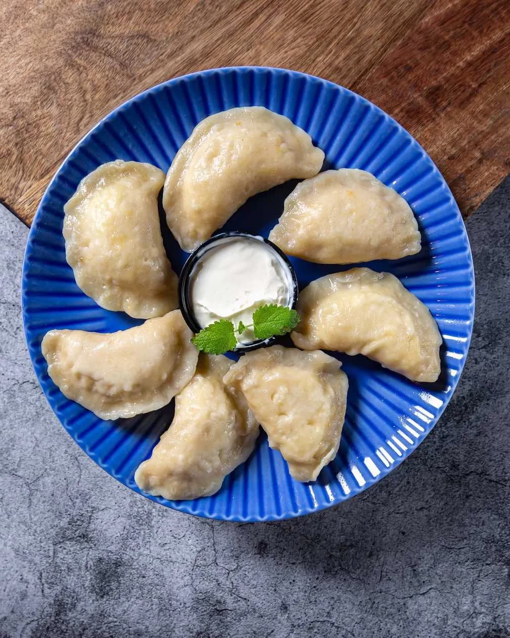 Dumplings with strawberries and fresh cream