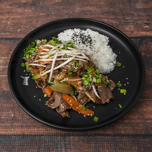 Beef with a bowl of rice