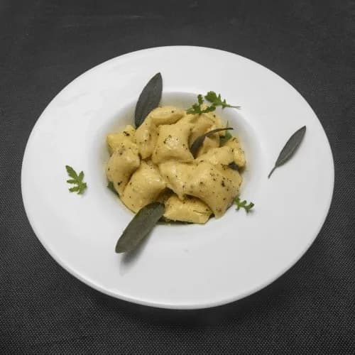Gnocchi with goat cheese and truffles in butter sauce