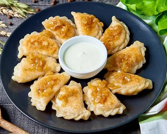 Pierogi Podmażane z Kapustą Duszoną i Borowikami
