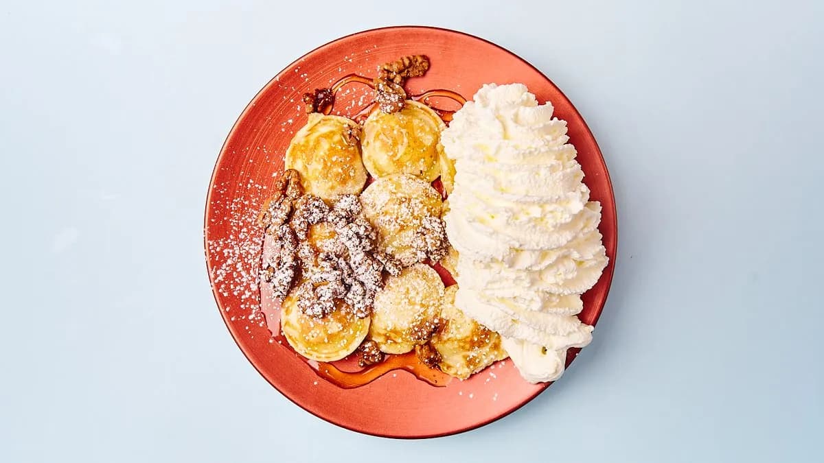 Poffertjes with Honey, caramelized Walnuts & Whipped Cream