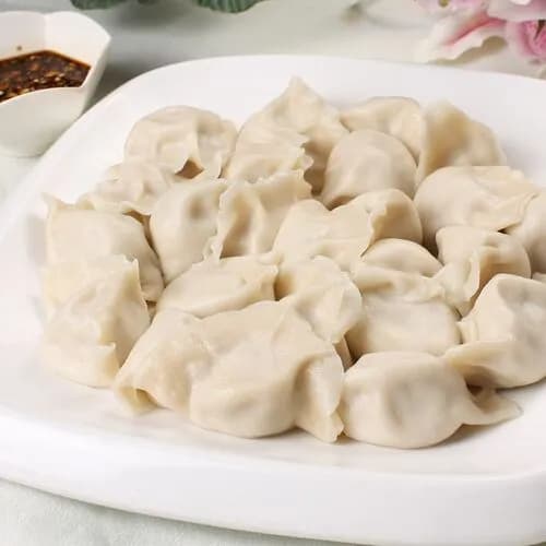 Пельмени со свининой и квашеной капустой