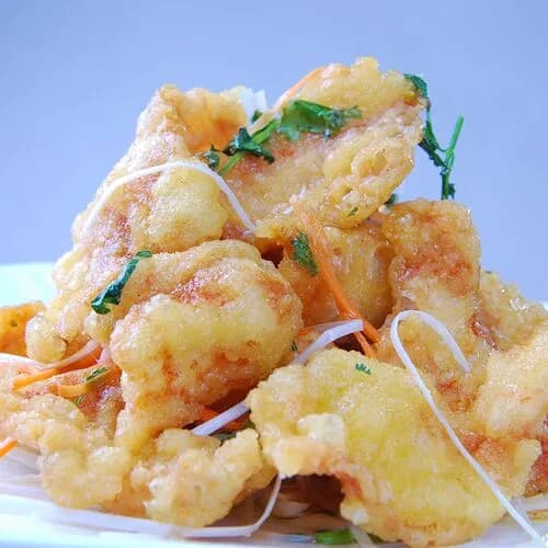 Жареные свиные отбивные в кисло-сладком соусе