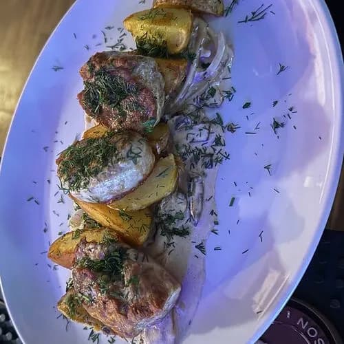 Медальоны из свинины с грибным соусом